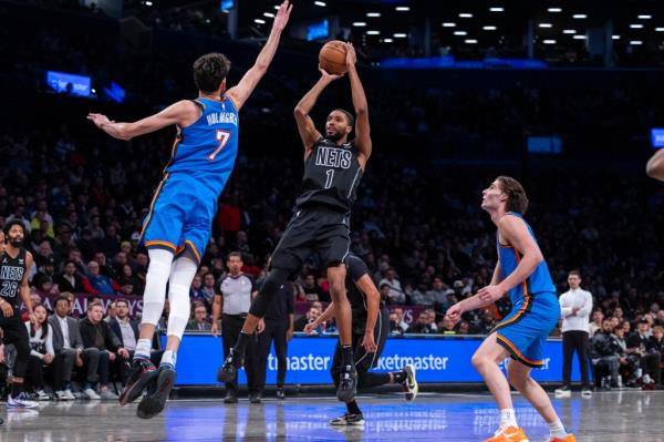 Mikal Bridges #1 of the Brooklyn Nets defends puts up a shot as Chet Holmgren #7 of the Oklahoma City Thunder jumps to defend in the first half at Barclays Center, Friday, Jan. 5, 2024, in Brooklyn, NY.