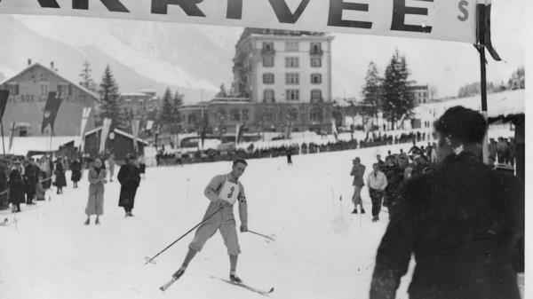 A skier arrives at the 1924 Games. 